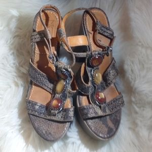 Bacio 61 Jeweled and leather sandals.